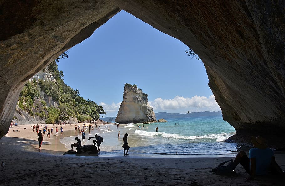 beach, new zealand, cathedral cove, sea, water, sky, group of people