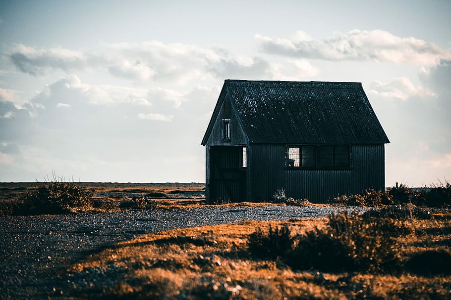 white hut on deserted land under white clouds during daytime, shallow focus photography of abandoned house HD wallpaper