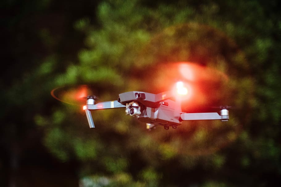 selective focus photography of drone flying on mid-air during nighttime, selective focus photography of flying quadcopter HD wallpaper