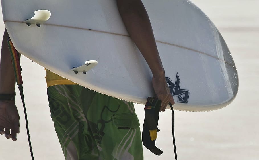man wearing green shorts carrying white surfboard, surfer, surfing HD wallpaper