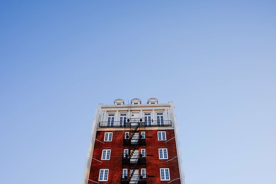 low angle photography of white and brown building, fire escape HD wallpaper