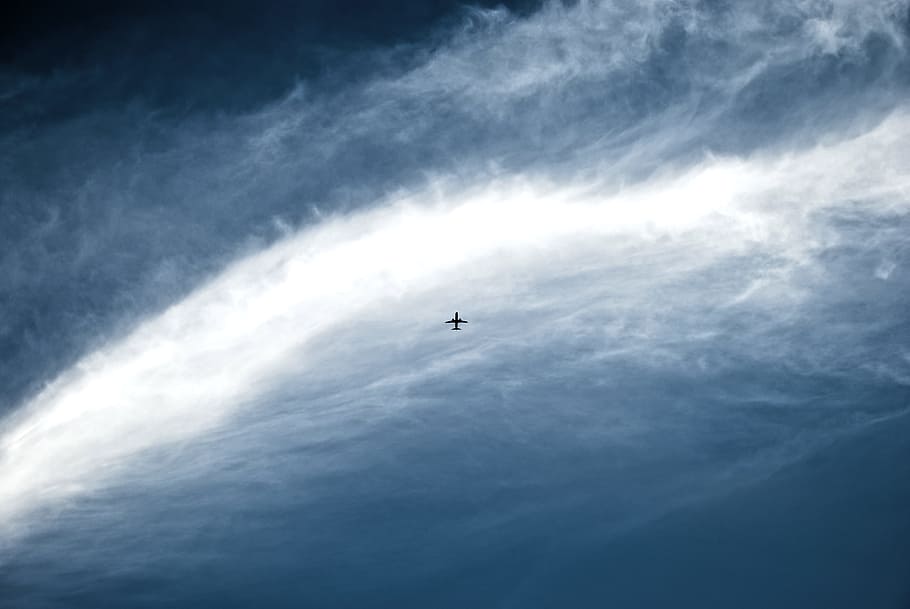 silhouette of jet plane on blue sky, plane on flight surrounded by clouds HD wallpaper
