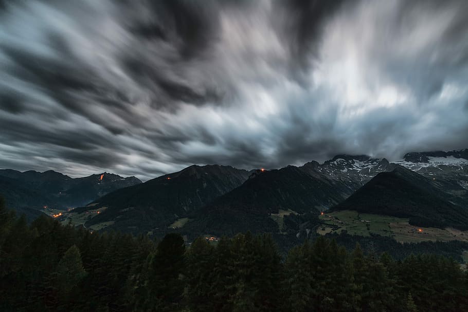 black mountain under nimbus clouds, green leaf trees background of mountain under cloudy sky HD wallpaper