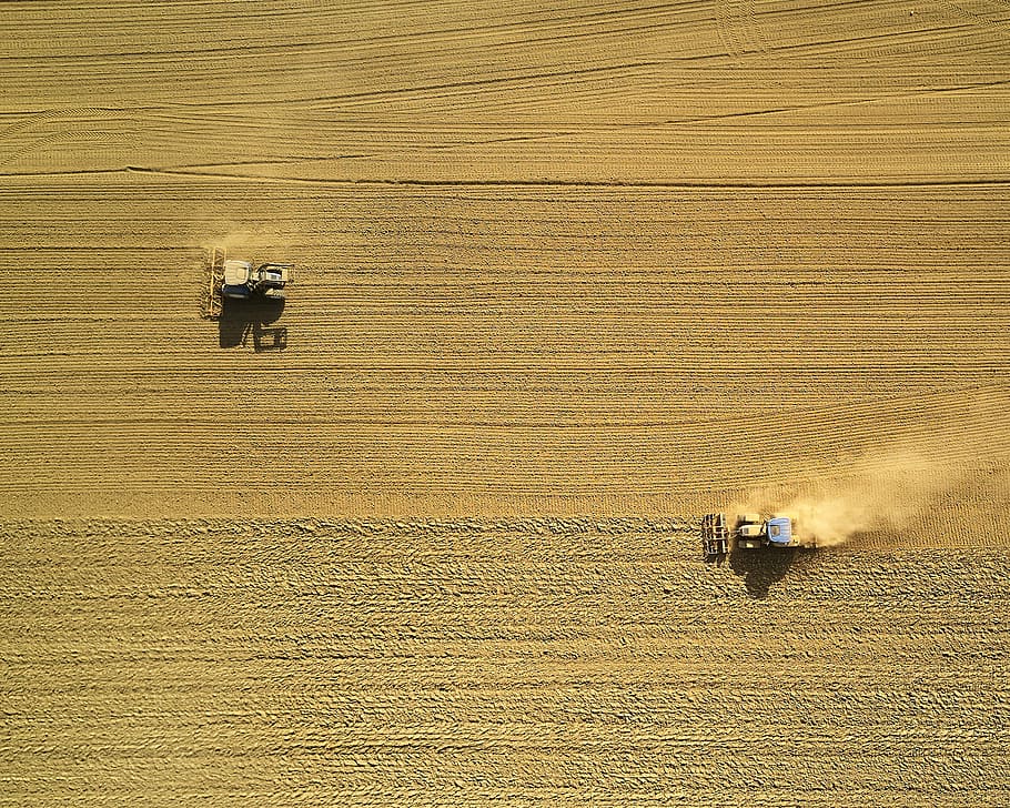 aerial view of two harvesters on brown field, two harvesters on field during daytime HD wallpaper