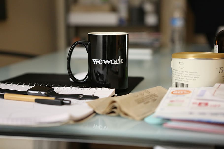 black ceramic mug on book, black wework-printed ceramic mug on black mousepad near white notebook, HD wallpaper