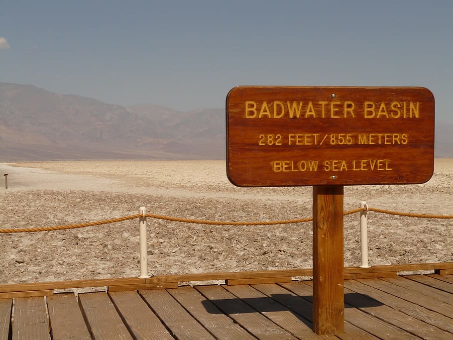 brown wooden signage on port, Badwater Basin, Salt Pan, salt lake