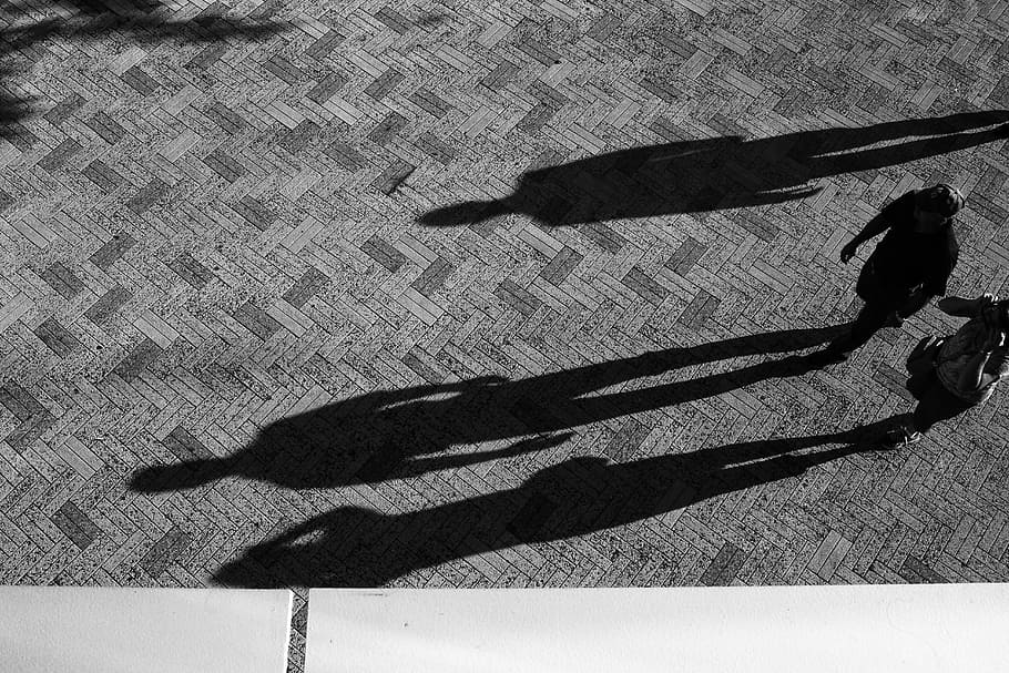 two people standing on concrete floor, man and woman walking near building HD wallpaper