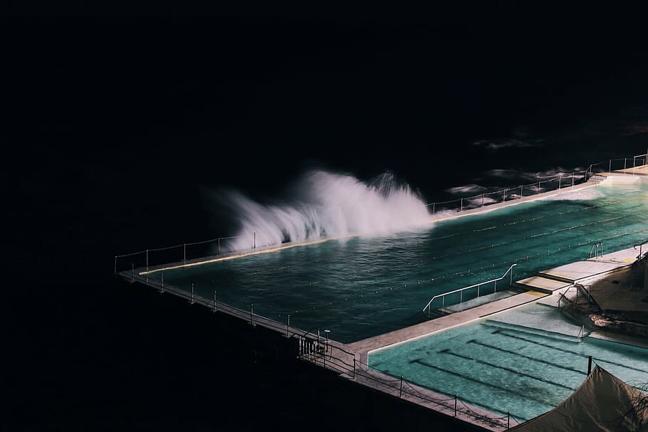aerial view photography of body of water, pool, wave, nighttime HD wallpaper
