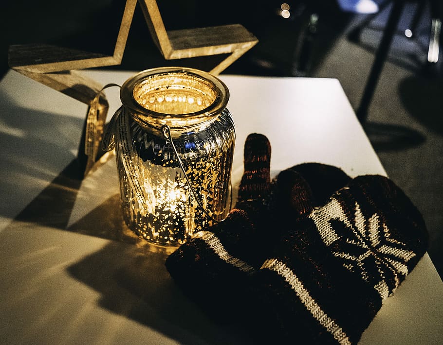 pair of black-and-white mitts, black-and-gray snow gloves beside jar HD wallpaper