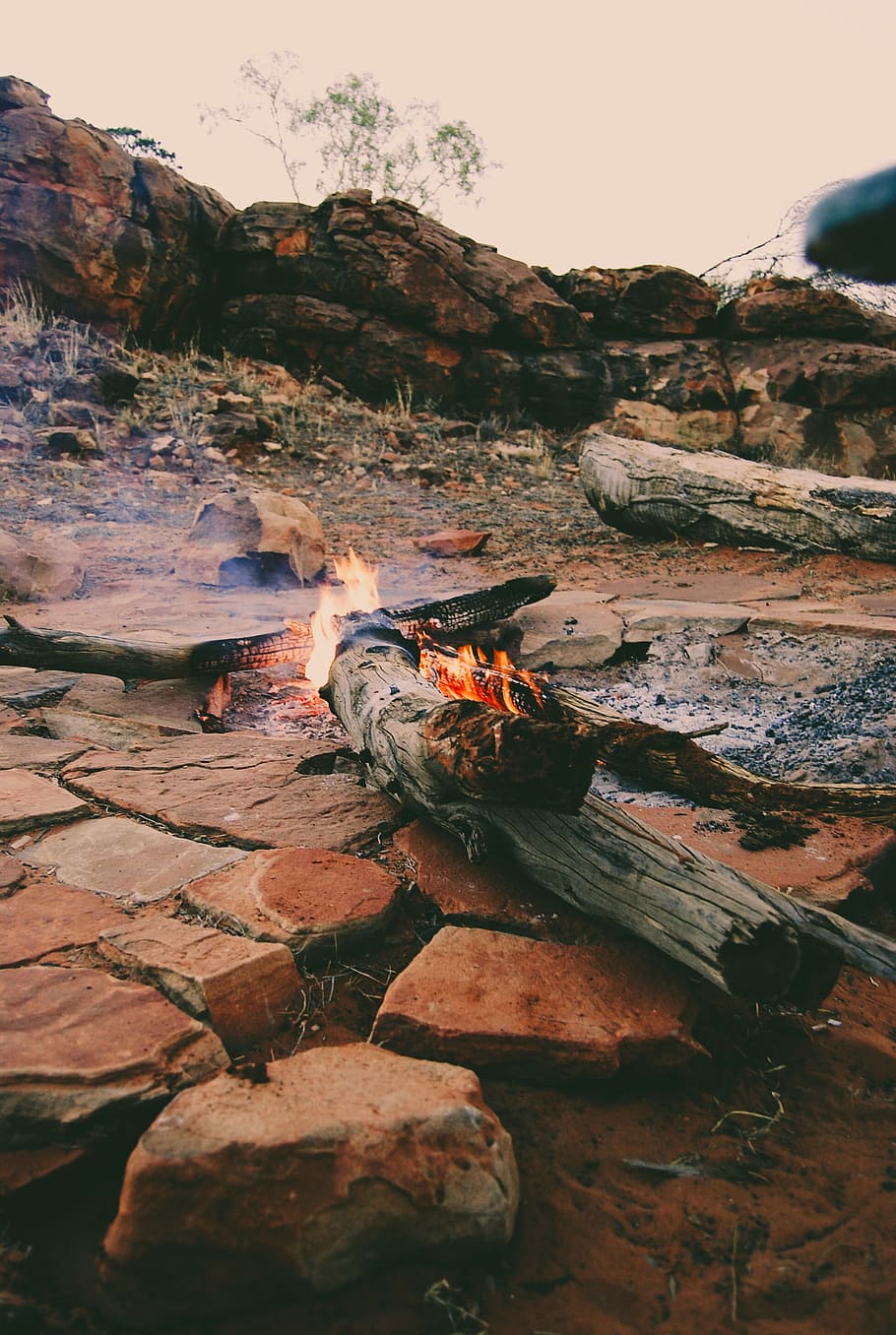 bonfire bear rocks at daytime, wood fire on rock, campfire, burning HD wallpaper