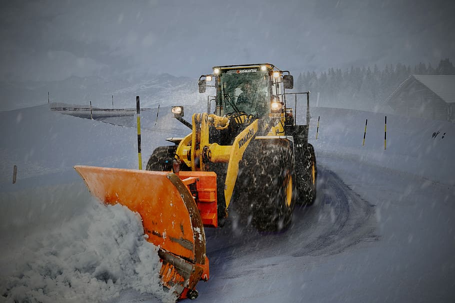 yellow and orange snow plouh, man riding backhoe plowing snow, HD wallpaper