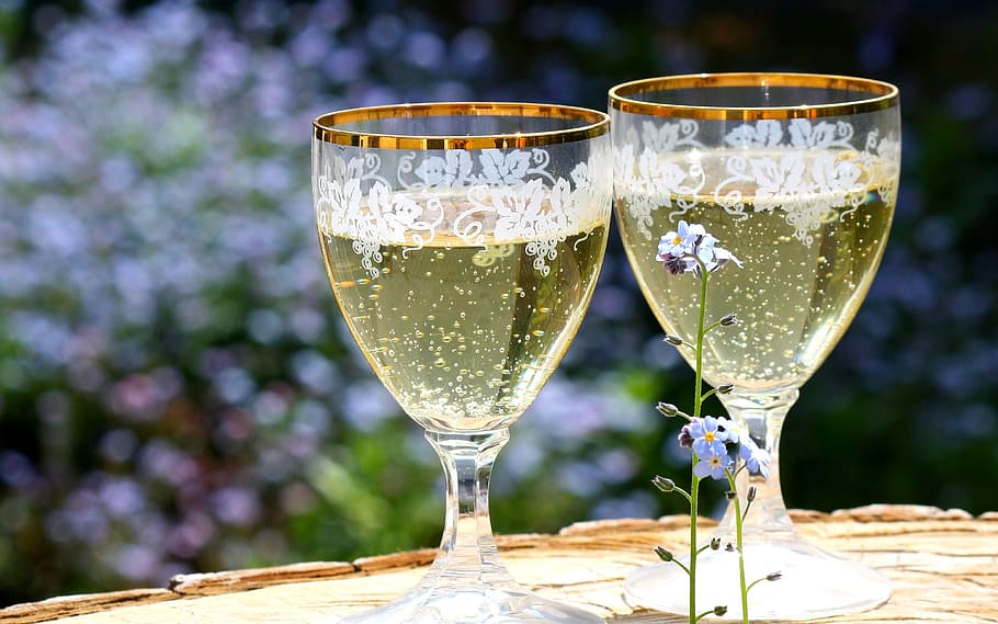 photo of two clear footed glasses filled with liquid, champagne HD wallpaper