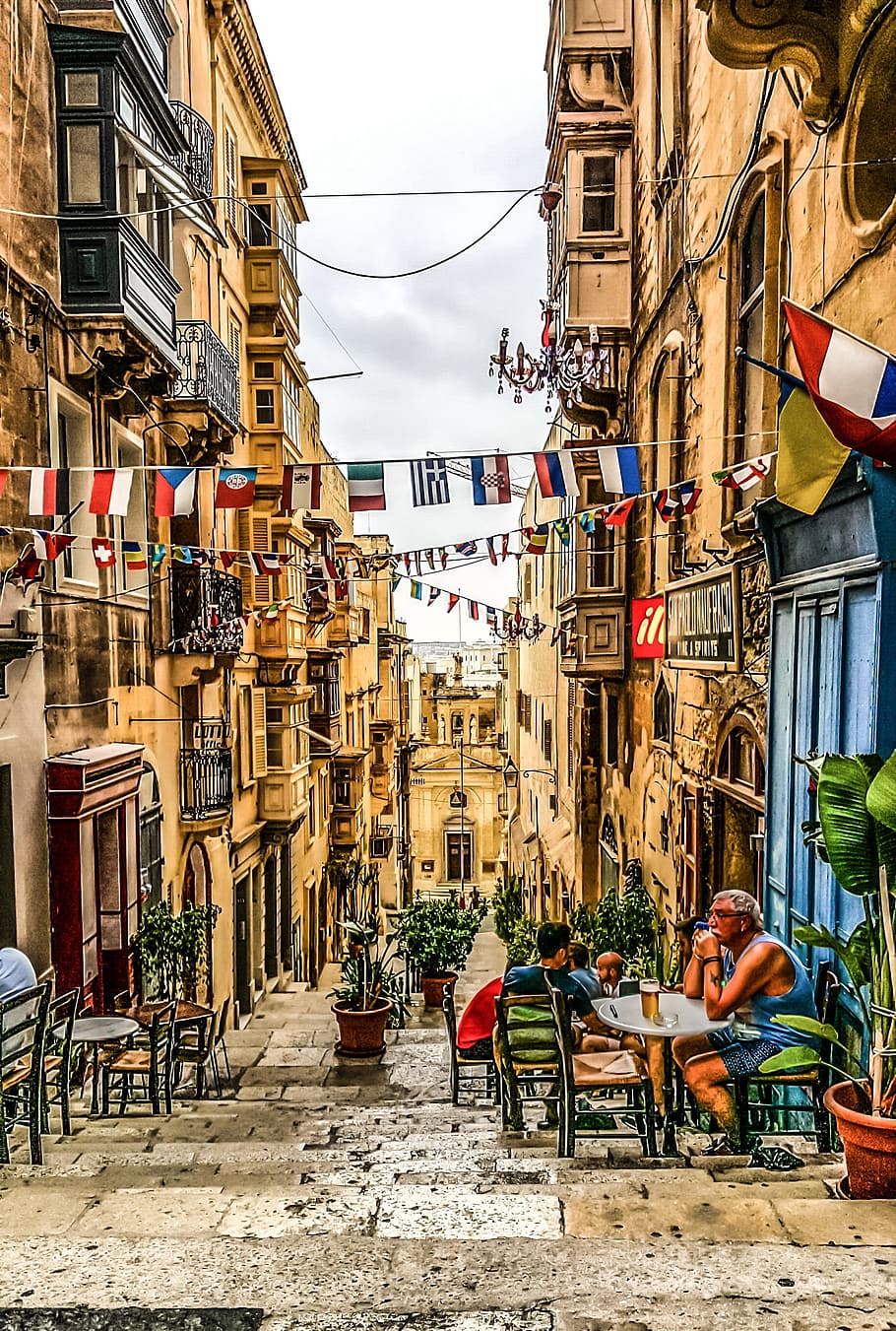 bunting of flags hanging between buildings, Malta, Island, Mediterranean