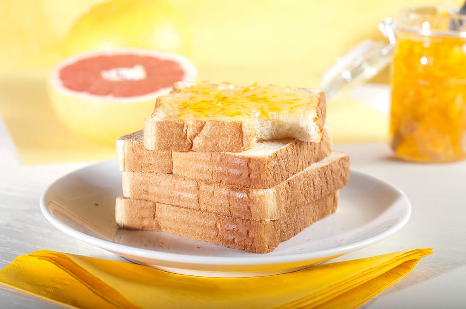 four sliced breads on plate, slice of loaf with jam on white ceramic plate HD wallpaper