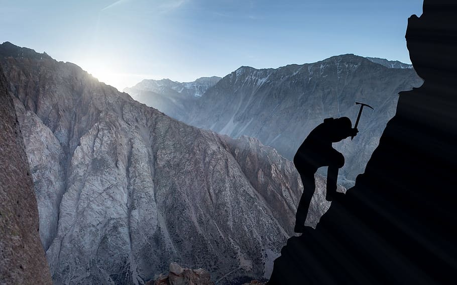 person climbing on mountain silhouette photo, mountaineering