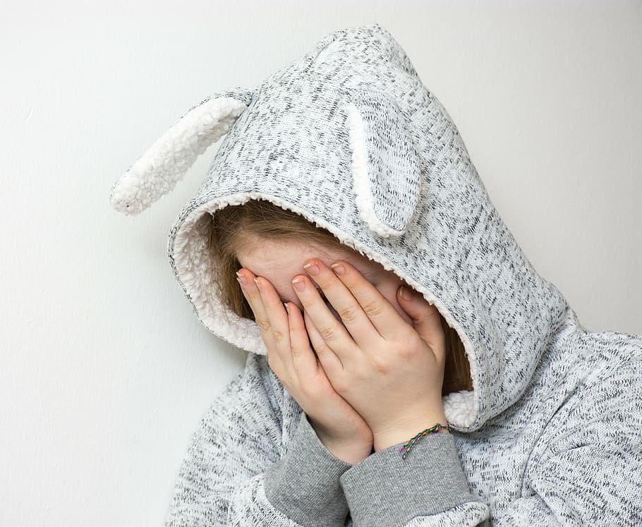 person wearing bunny blanket sleeper, desperate, sad, depressed
