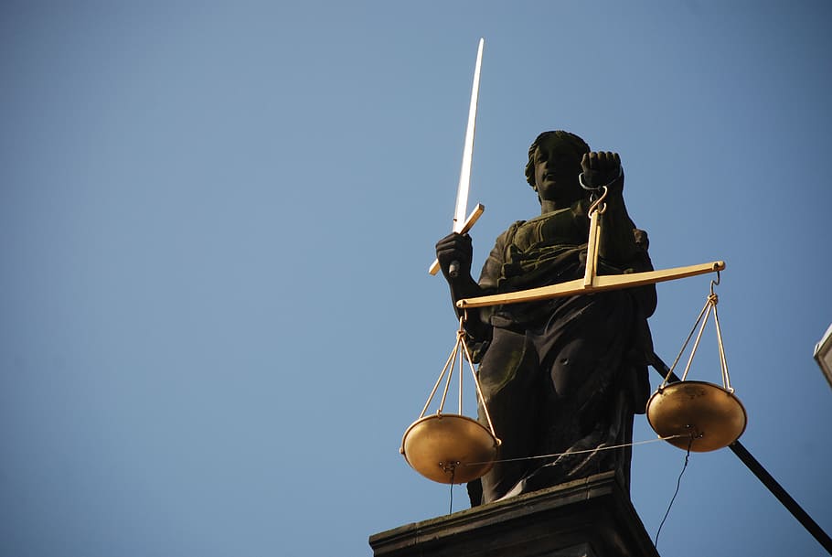 closeup photo of Lady Justice statue, case-law, right, scale