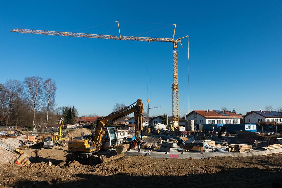yellow excavator and construction crane at daytime, site, sky HD wallpaper