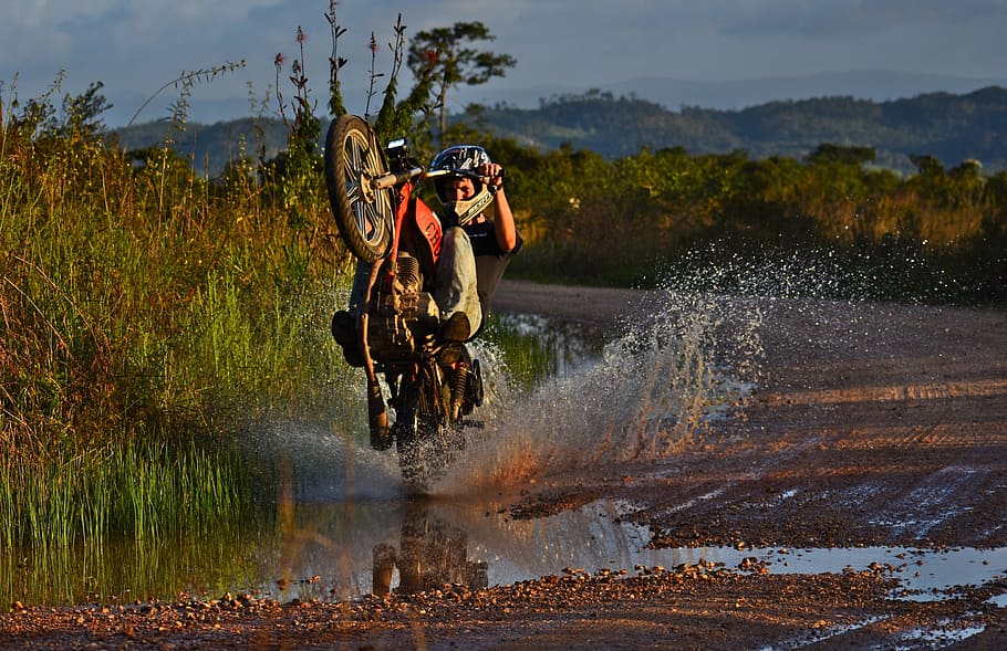 man riding red and white motor cycle, wheeler, motorcycle, splash HD wallpaper