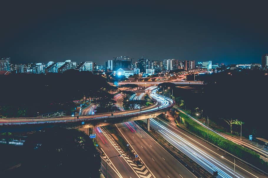 time lapse photo of concrete highway with cars, time-lapse photography of asphalt roads under night sky HD wallpaper
