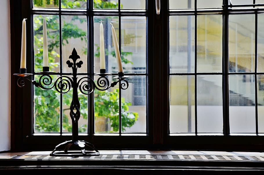 black steel candelabra near window, candles, candlestick, candle holders HD wallpaper
