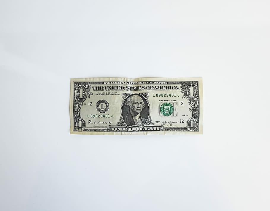 1 U.S. dollar banknote, 1 U.S dollar banknote on top of white surface