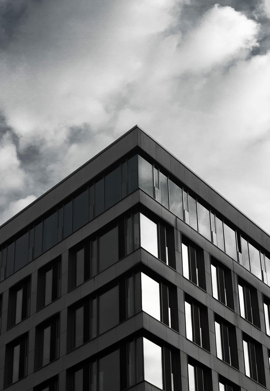 gray building under cloudy sky during daytime, low angle view photography of gray building HD wallpaper