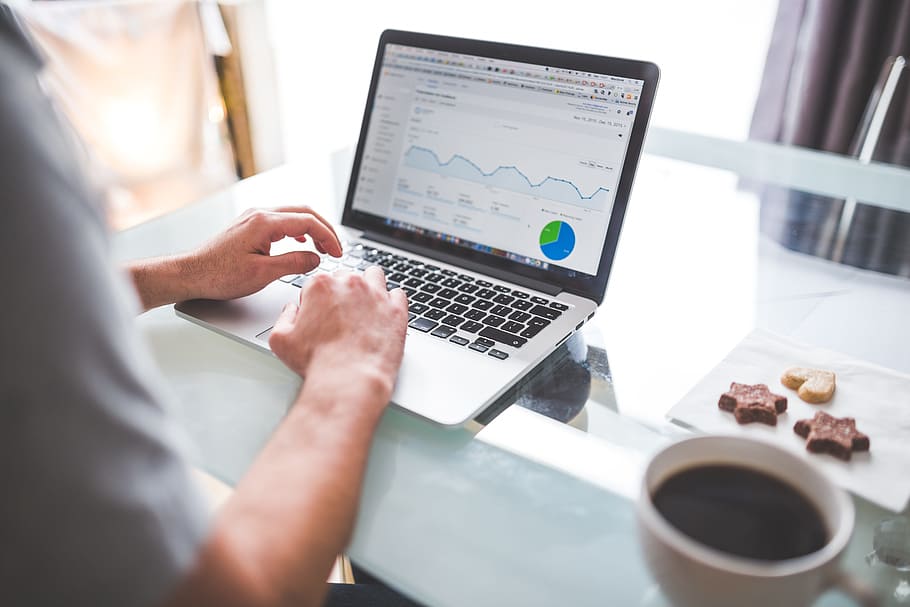 person using laptop beside mug on table, analytics, charts HD wallpaper