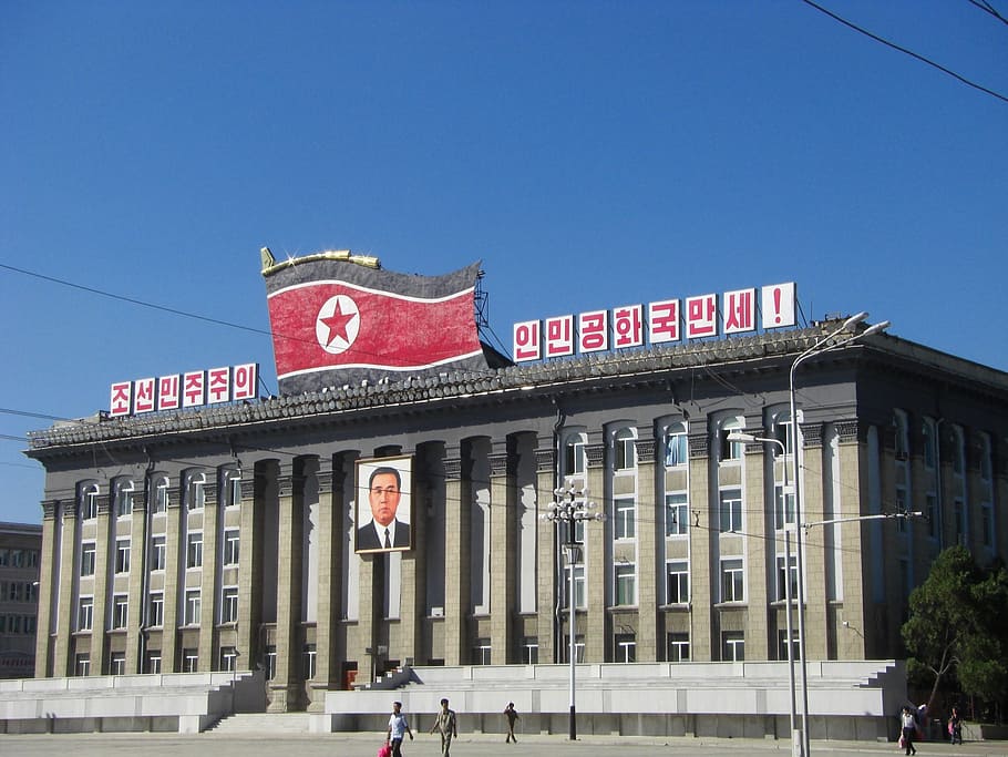 red flag on roof top, north korea, pyongyang, building, kim il sung square, HD wallpaper