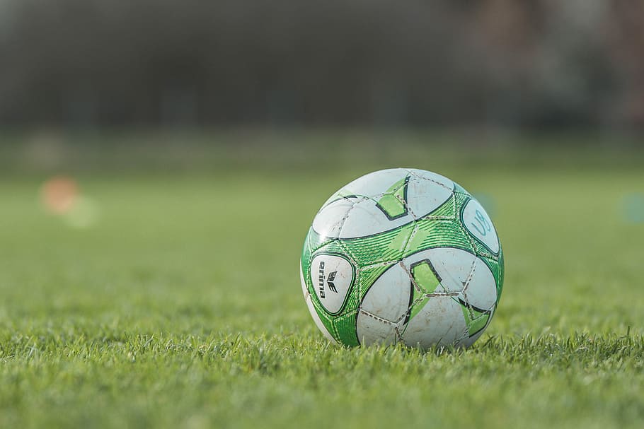 selective focus photography of a green soccer ball, grass, sport HD wallpaper