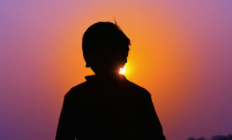 silhouette of boy during golden hour, sunset, india, travel, asia