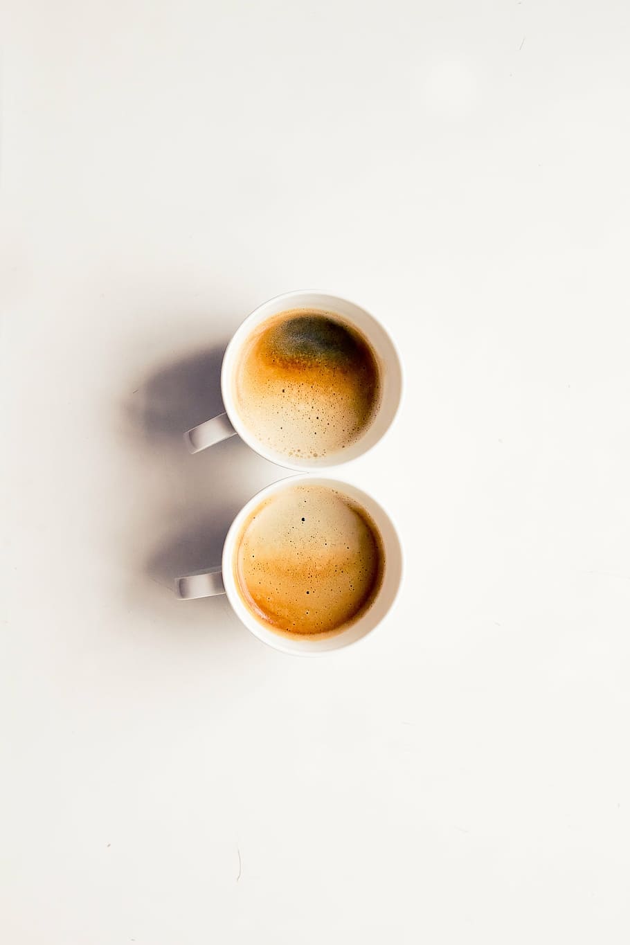 two white coffee mugs on white surface, art, coffee - drink HD wallpaper
