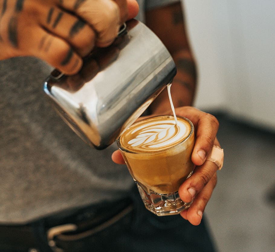 man holding clear drinking glass with coffee and pouring with milk, man pouring cream on coffee HD wallpaper