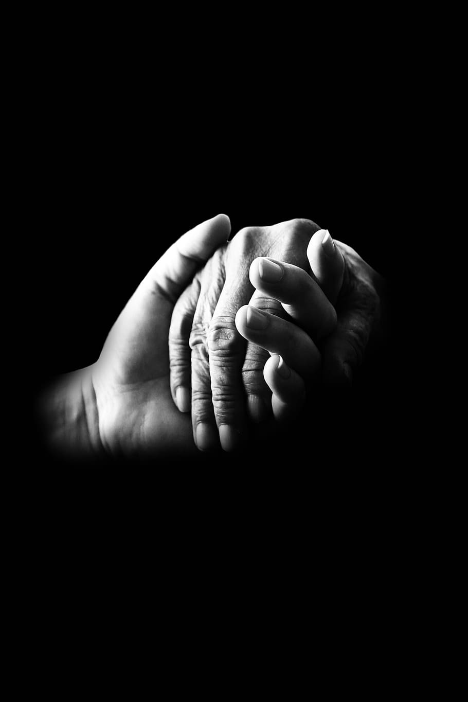 grayscale photo of two hands holding each other, compassion, help