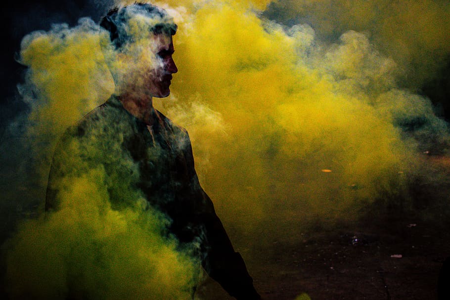 man standing surrounded by yellow smoke, man covered with yellow smoke, HD wallpaper