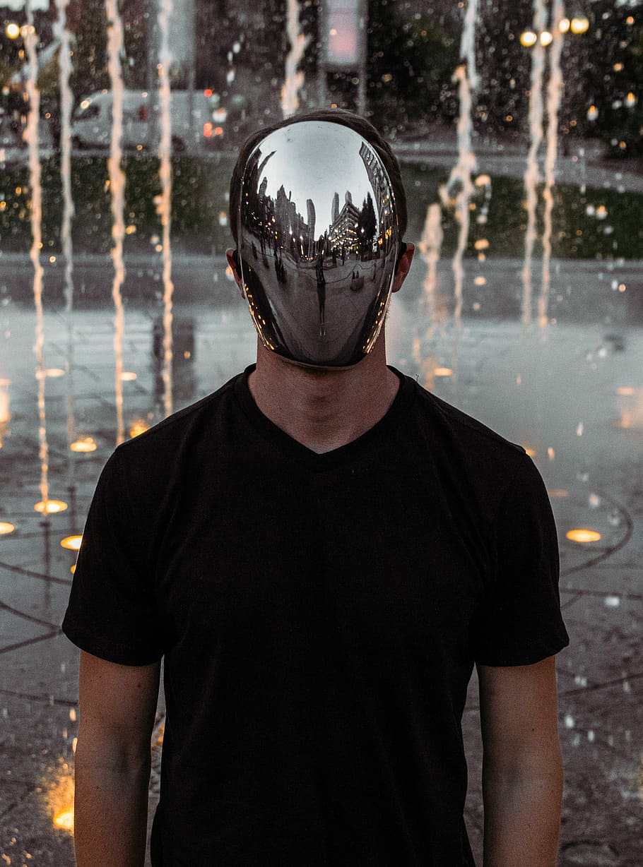 man covering his face standing, man wearing black crew-neck shirt and stainless steel mask, HD wallpaper