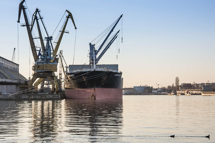 black and gray cargo ship on body of water, port, loading, discharging