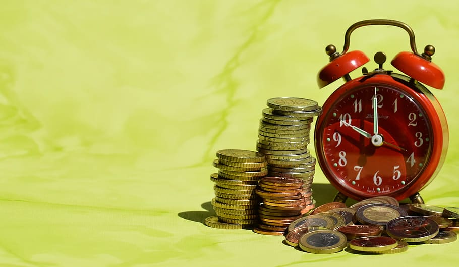 stack and pile of coins beside 2-bell alarm clock, time is money, HD wallpaper