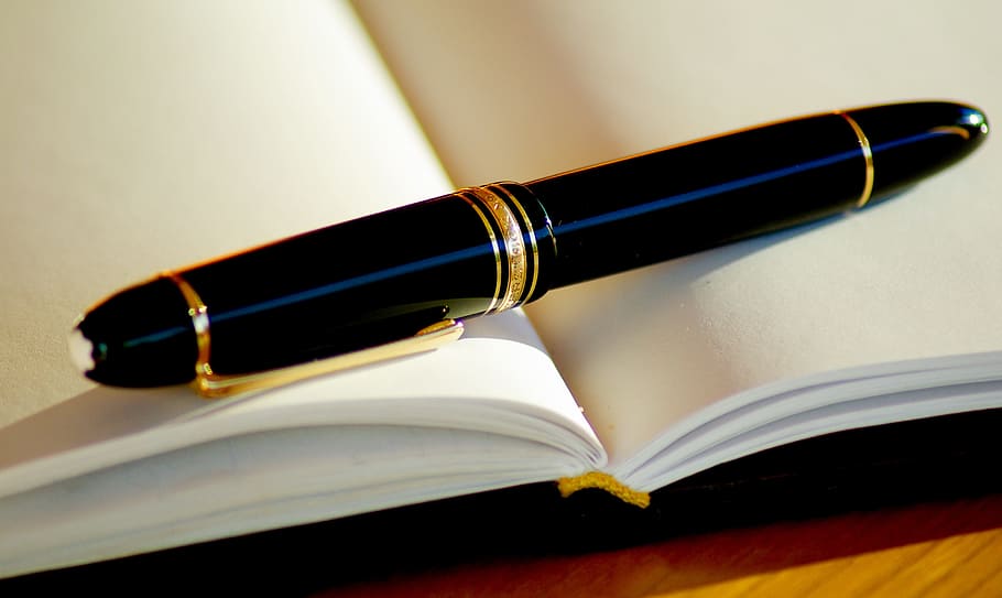 black twist pen on opened book, ink, fountain pen, writing, open book