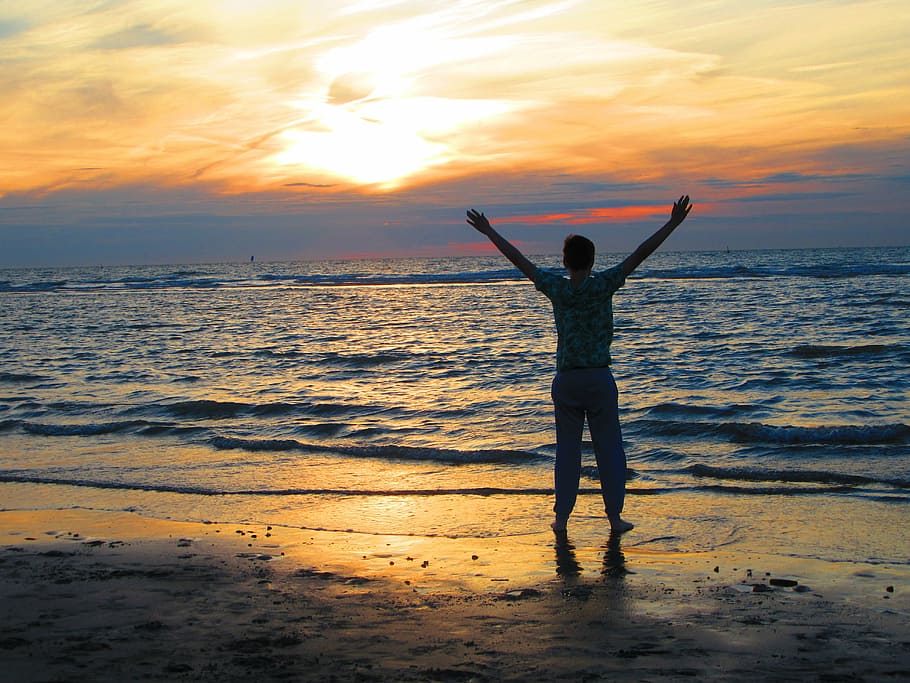 man standing on seashore during sunset, boy, brand, beach, horizon HD wallpaper