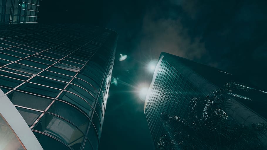 low-angle photography of grey building at night, dark, architecture