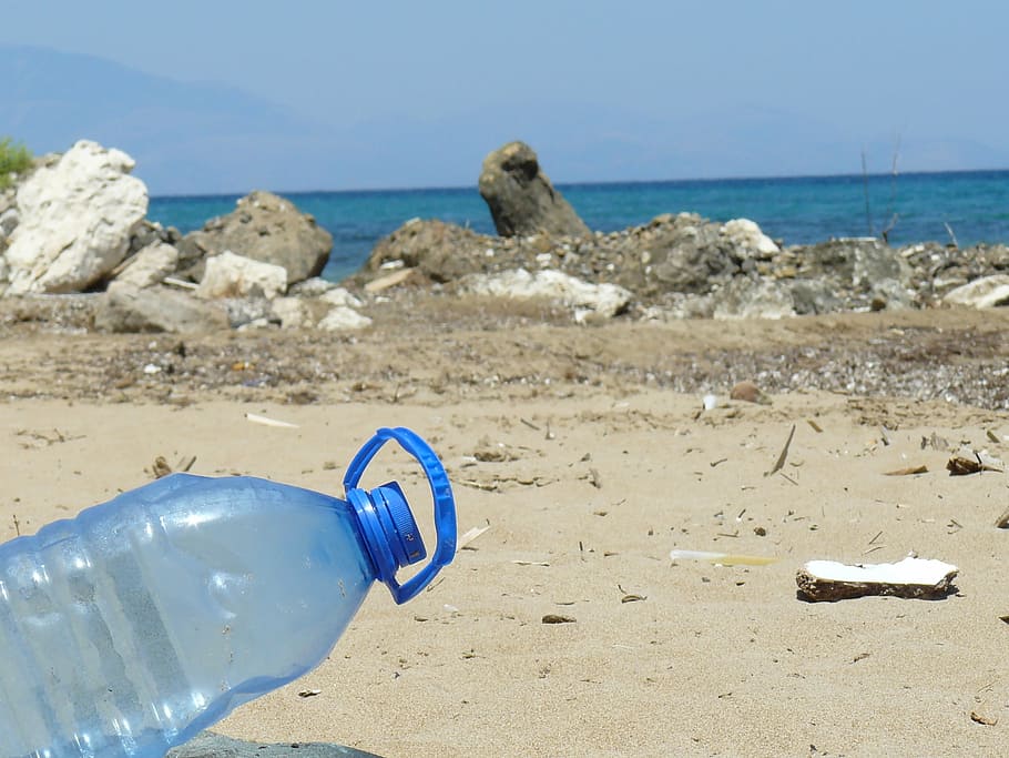 blue plastic gallon near body of water during daytime, plastic bottle HD wallpaper