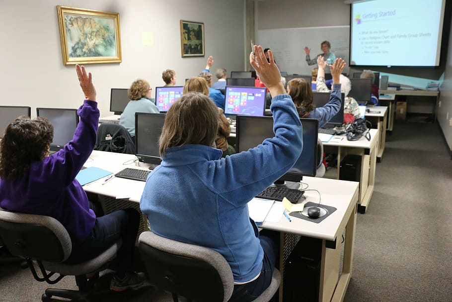 person raising hand, classroom, computer, technology, training