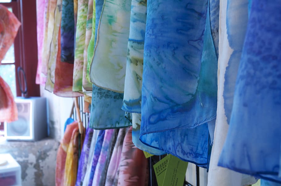 selective focus photography of assorted-color hanging clothes HD wallpaper
