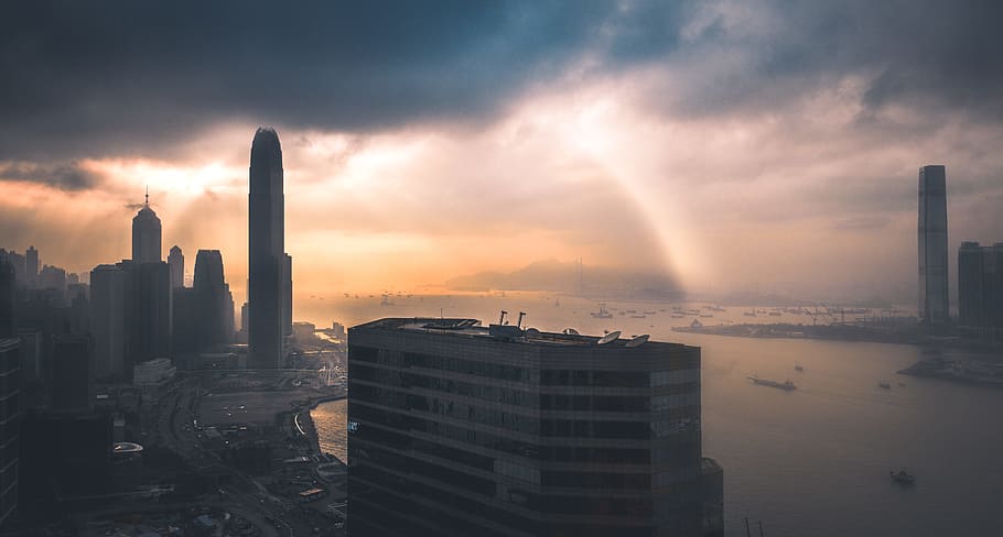 building near sea, aerial photography of cityscape during daytime HD wallpaper