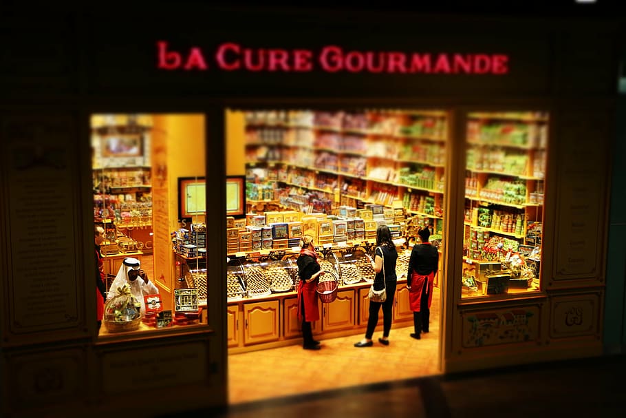 people inside La Cure Gourmande store, dubai, shop, shopping