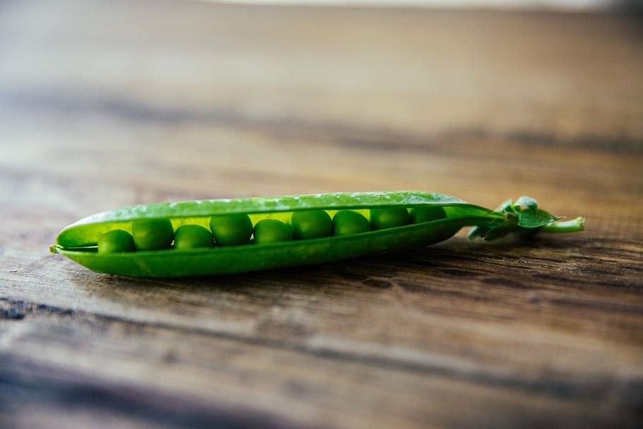 green peas on brown wooden surface, table, bokeh, food, seed, HD wallpaper