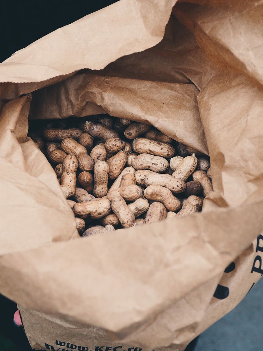 brown peanuts in brown opened paper bag, peanut lot in brown paper bag HD wallpaper