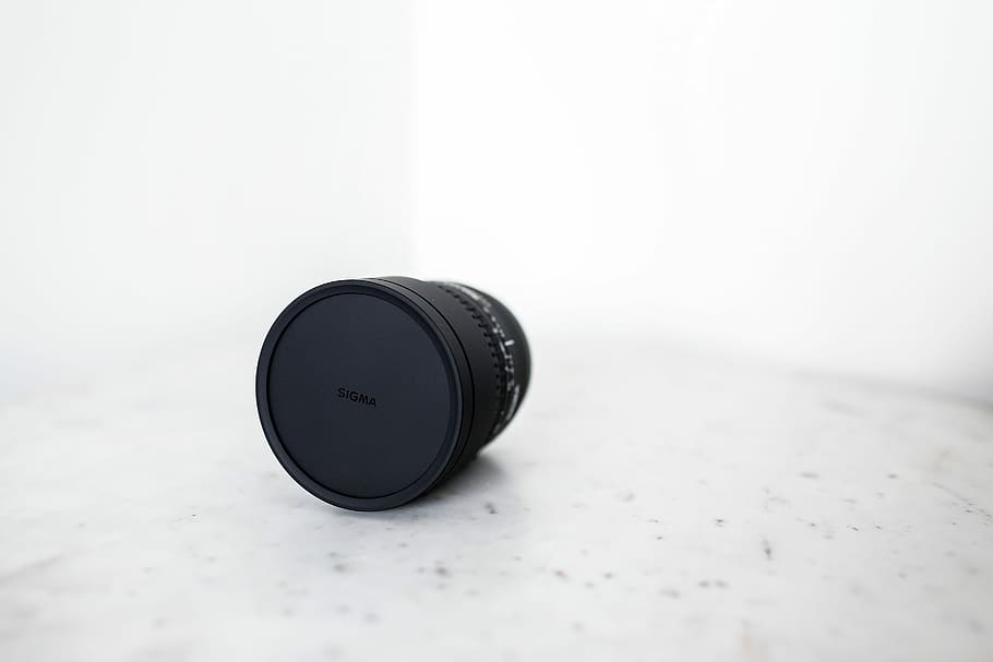 black camera lens on white surface, black DSLR lens, lens cap HD wallpaper