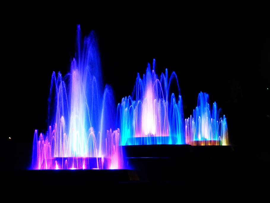 fountains with blue and purple lights, water, illuminated, colorful